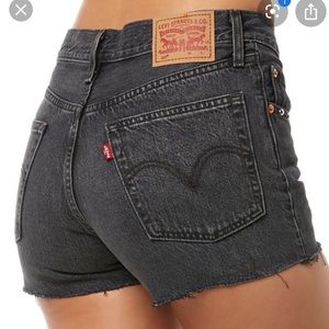 501 mid rise black levi jean shorts